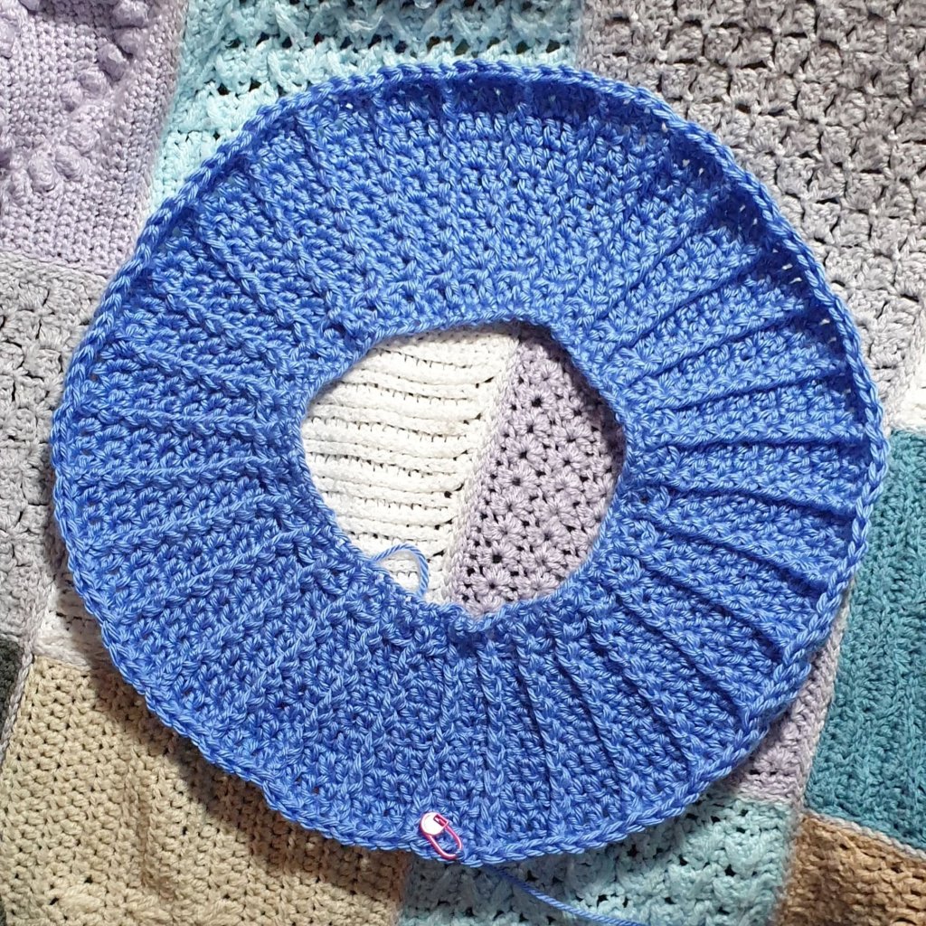 The start of the Luna Sweater which is a ring of crochet